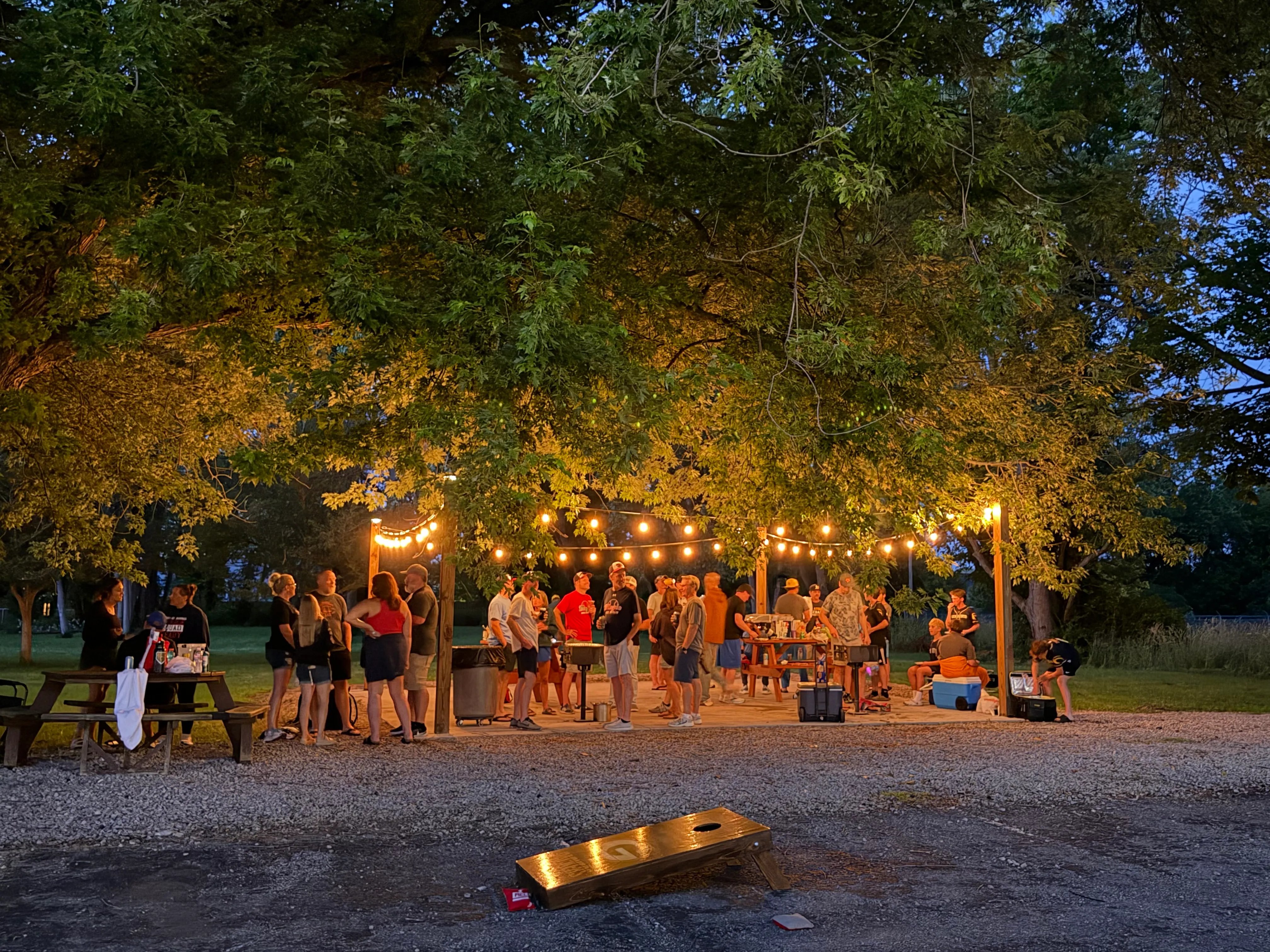 BBQ area at South Shore Inn lit up on a summer evening