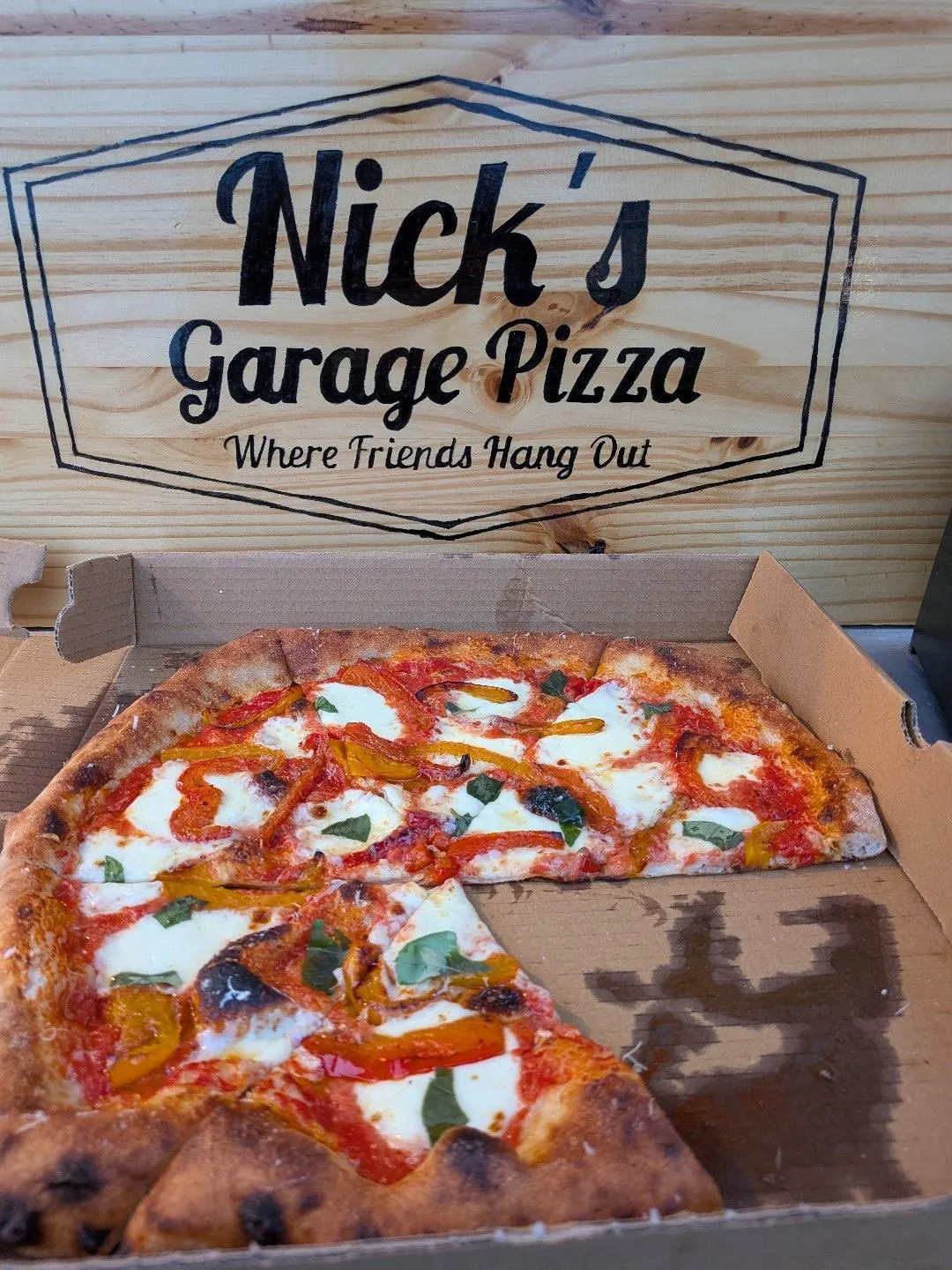 Wood-fired pizza from Nick's Garage Pizza at South Shore Inn