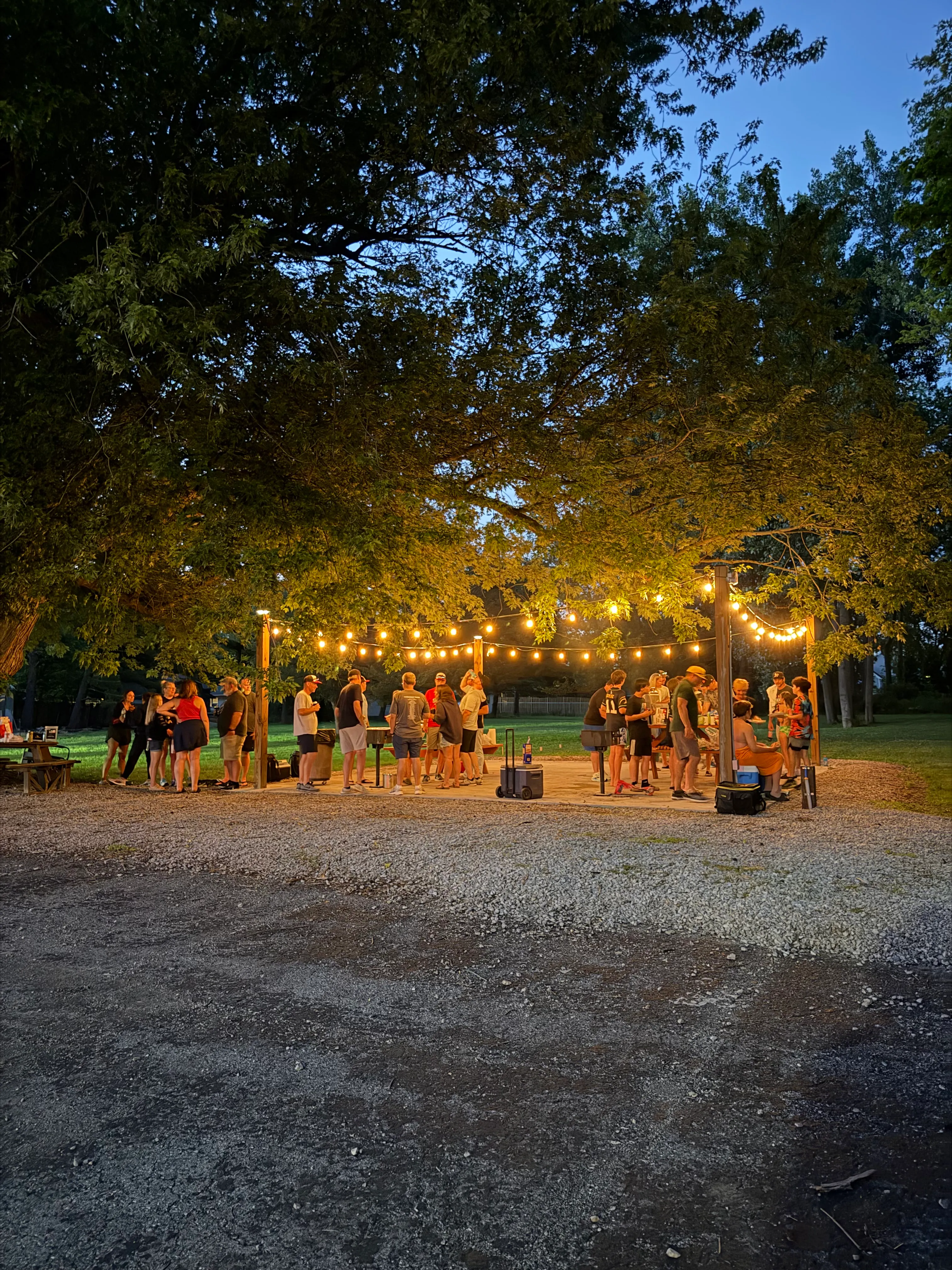 Guests having fun at the BBQ patio area on a summer evening